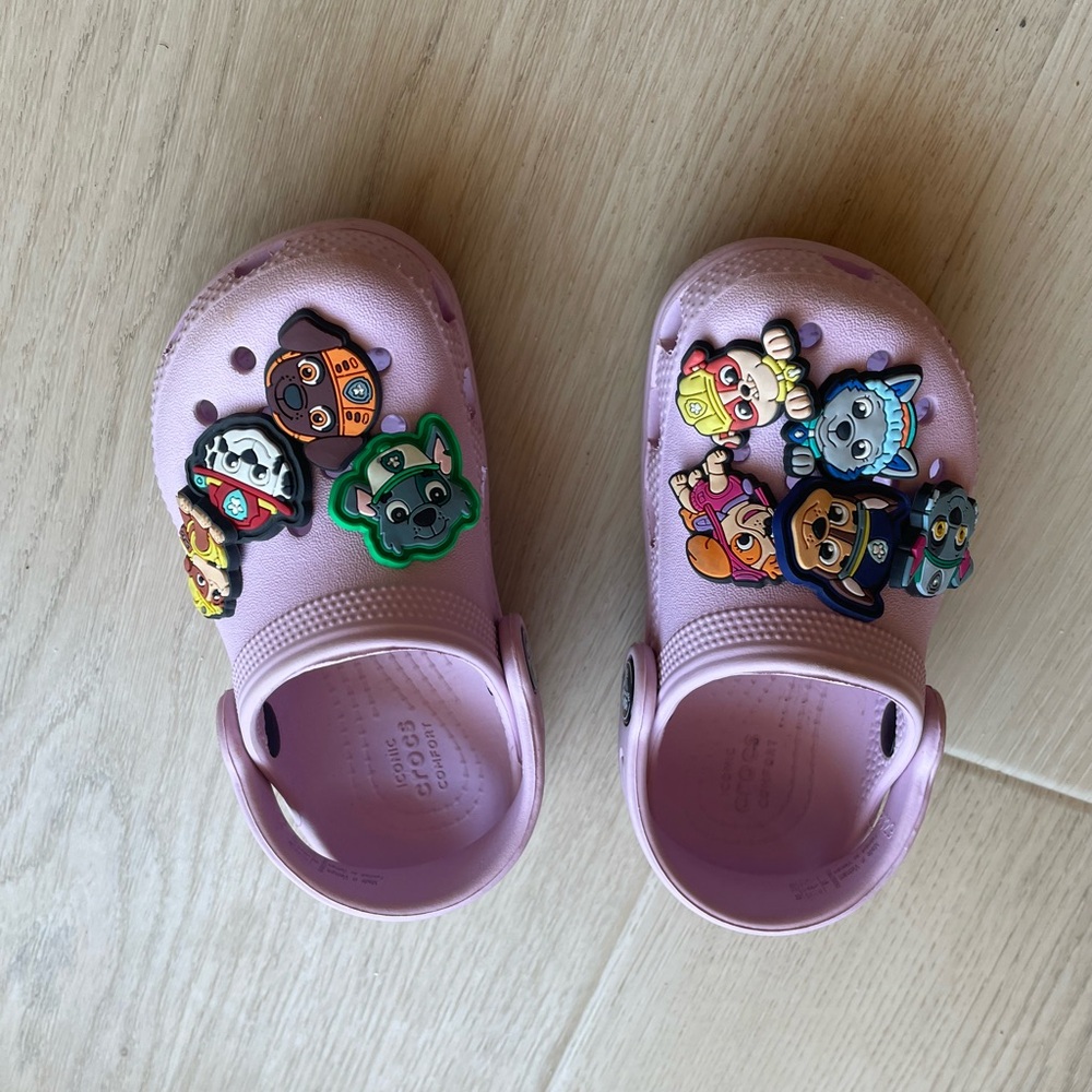 Light pink crocs with paw patrol charms size 8